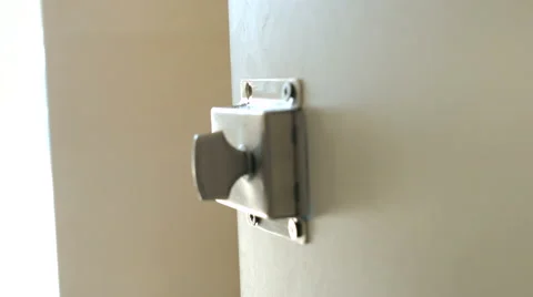 Closeup of Fixing the Door Latch Using a Power Screwdriver Video stock 63441262