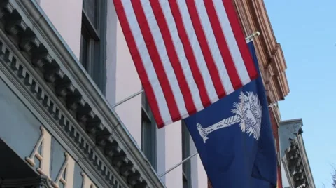 Closeup flags hanging outside Aaron's Deli Stock Footage 45532932