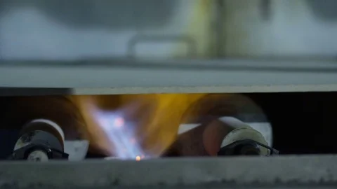 Closeup Flame between Rolls under Drywalls in Furnace Stock Footage 72738245