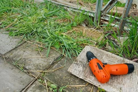 Closeup flat lay of tools , screwdriver, top view garden background Stock Photos