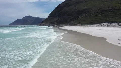 Closeup flight over sandy beach and calm blue wave Vídeo Stock 207218947
