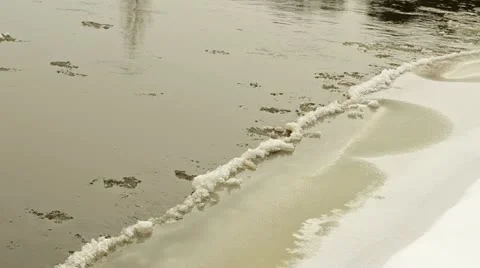 Closeup floe float water touch ice cover snow river bank Video stock 22417520