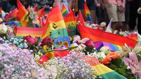 Closeup of flowers and pride flags at a ... | Stock Video | Pond5