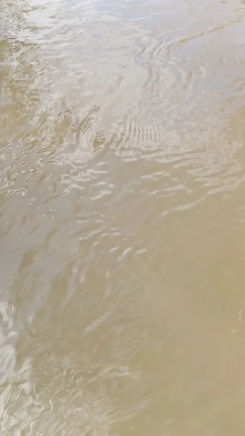 Closeup of flowing river water	texture Stock Footage 320487630