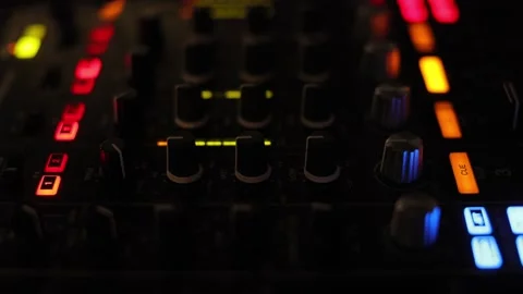 Closeup footage of a DJ booth at night club party for music mixing Stock Footage 249760632