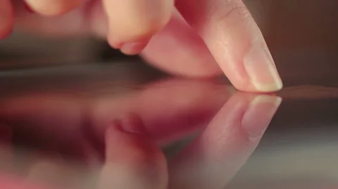 Closeup footage of a female hand using iPad and browsing photosw, touchscreen Stock Footage