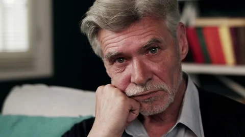 A closeup footage of an old man thinking deeply over something. An elderly grey 库存影片 132667528