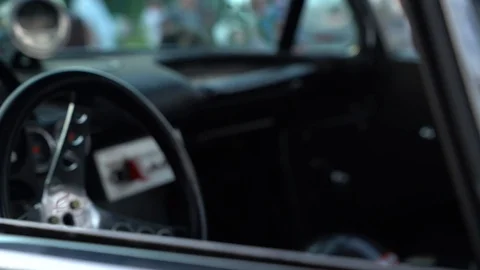 Closeup Footage of Steering column and trim of 1960s Race Car Stock Footage 113665460