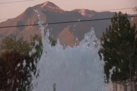 Closeup fountain with Mountains in the Background Stock Footage