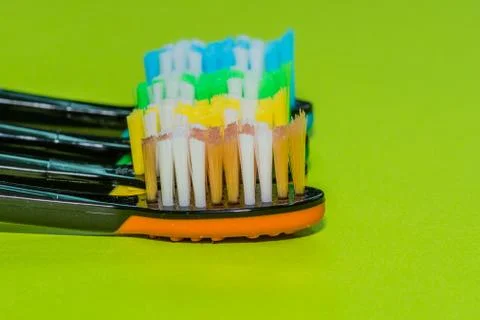 Closeup of four toothbrushes Stock Photos