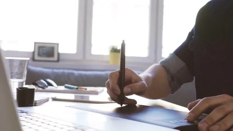 Closeup of freelance graphic designer working with tablet Stock Footage 72870639