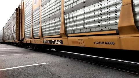 Closeup of Freight Train Passing into the Distance Stock Footage 81415701
