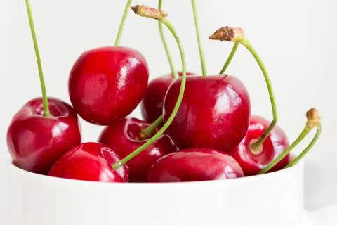 Closeup of fresh cherries in white bowl Stock Photos
