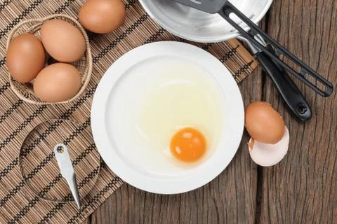 Closeup fresh egg isolate on white plate Stock Photos