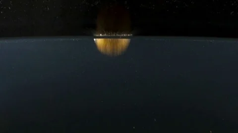 Closeup of fresh kiwi falling into water on the black backgrond slow motion Stock Footage 75791009