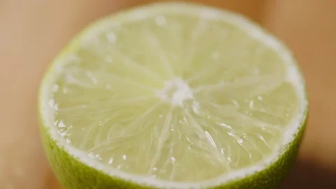 Closeup Of Fresh Lime Cut Rotating On Table Stock Footage 86119595