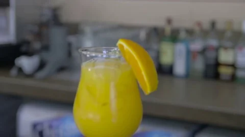 Closeup of a fresh orange juice with ice cubes Stock Footage 71030964