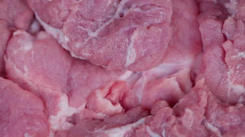 Closeup of fresh pork chunks showing marbling and frosty surface. Overhead shot Stock Footage 331698311