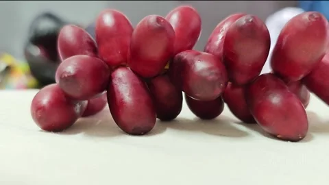Closeup of Fresh Red Date Palm Fruits Cluster. Stock Footage 340488190