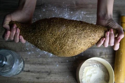 Closeup of fresh rustsic bread in a woman's hand Stock Photos