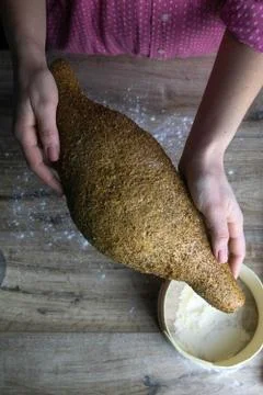 Closeup of fresh rustsic bread in a woman's hand Stock Photos