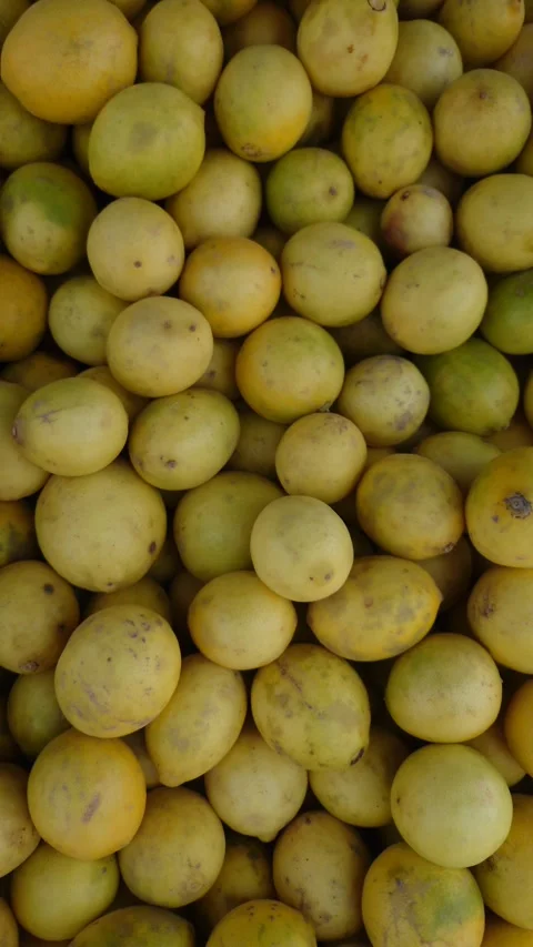 Closeup Of Fresh Yellow Lemons Background Top View - 4k Vertical Footage Stock Footage 339304926