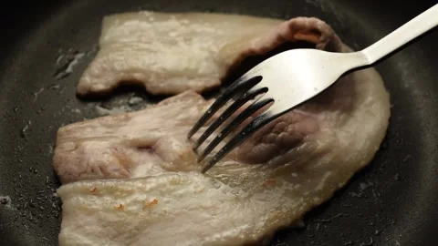 Closeup on fried bacon in the pan Stock Footage 136361149