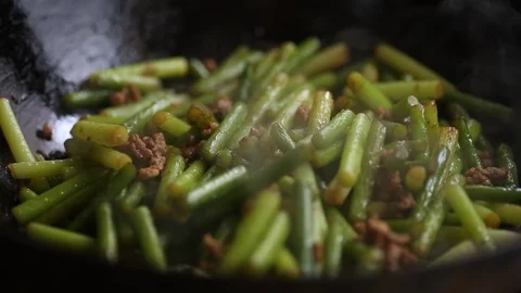 Closeup: Fried garlic bolt with soy sauce and meat in Chinese cooking style. Stock Footage 126900798