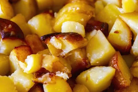 Closeup fried potatoes, background texture Stock Photos
