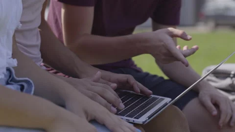 Closeup of friends using laptop and typing Video stock 202896654