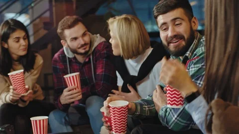 Closeup in front of the camera multiethnic group of friends have a little party Stock Footage 122761479