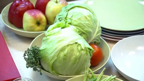 Closeup of fruits and vegetables for salad on the plate Stock Footage 77036341