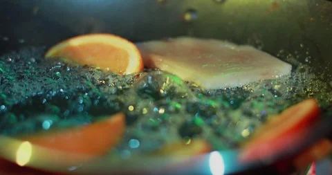 Closeup of fry oranges in a pan. Stock Footage 103383429