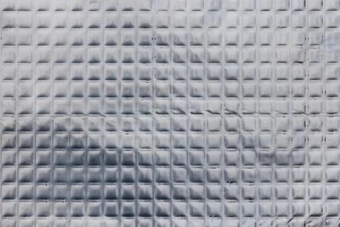 Closeup full-frame background and texture of aluminum coated butil rubber sheet Stock Photos