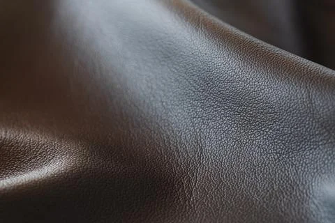 Closeup full grain gray brown leather background Stock Photos