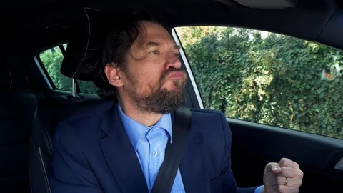 Closeup of funny man dancing in car while driving slow motion Stock Footage 108255936