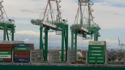 Closeup-Gantry container cranes unloading containers from cargo ship Stock Footage 106861684