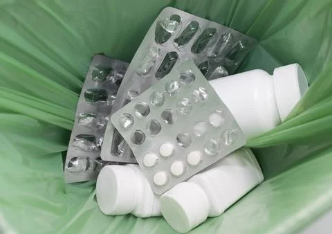 Closeup Garbage Can, Trash Bin Full Of Medication. Pills, Tablet Bottles, Empty Stock Photos