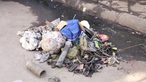 Closeup of Garbage on Roadside, 4K Footage Stock Footage 332557613