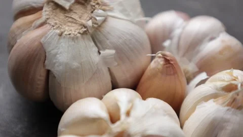 Closeup of garlic on wooden table Stock Footage 286780588