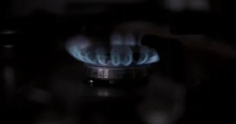 Closeup of a gas burner with bright flames, highlighting its cooking function 動画素材 297374050