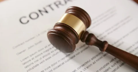 Closeup Of Gavel On Contract Paper At Table 4K Video stock 86084110