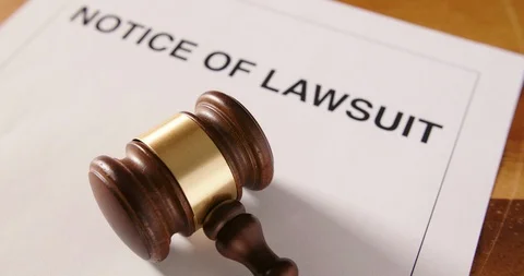 Closeup Of Gavel Over Notice Of Lawsuit Text  4K Stock Footage 86083953
