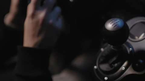 Closeup of the gear shifter on a driving simulator Stock Footage 258384014