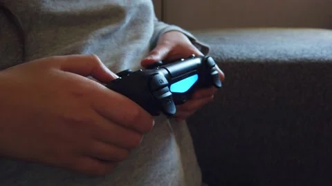 Closeup of girl hands holding a controller and playing video game. Stock Footage 150274921