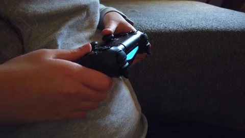 Closeup of girl hands holding a controller and playing video game. Stock Footage 150274925