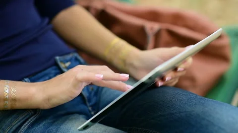 Closeup of a girl using tablet in the park Stock Footage 61004283