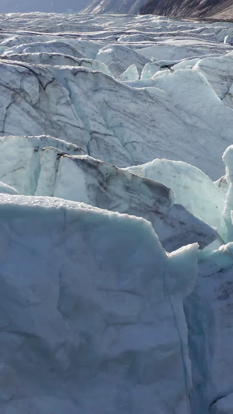 Closeup Of Glacial Formations Revealing Deep Blue Ice Cracks In Greenland. - Stock Footage 346523254