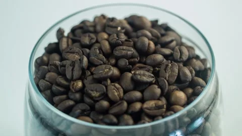 Closeup of glass jar with fragrant roasted coffee beans. Stock Footage 104324947