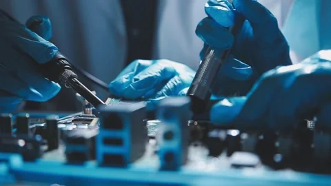 Closeup of a gloved hand installing a microchip on a blue motherboard. Perf.. Stock Footage 341547284